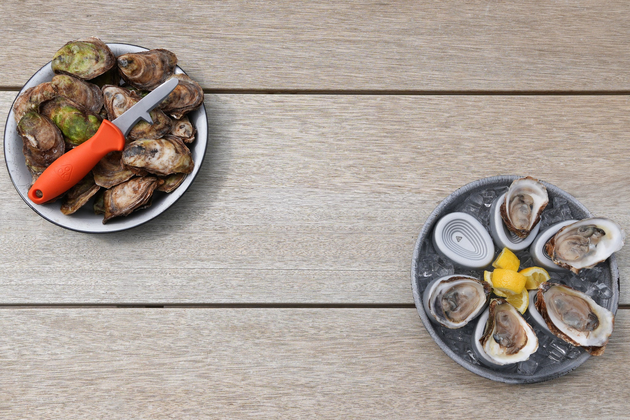 OCK Oyster Knife and Oyster Coasters with fresh oysters on a wood table
